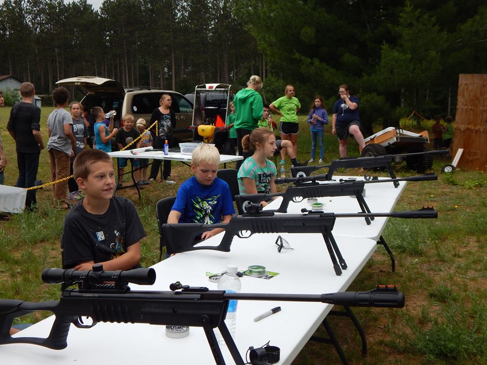 youth get ready to shoot at the range