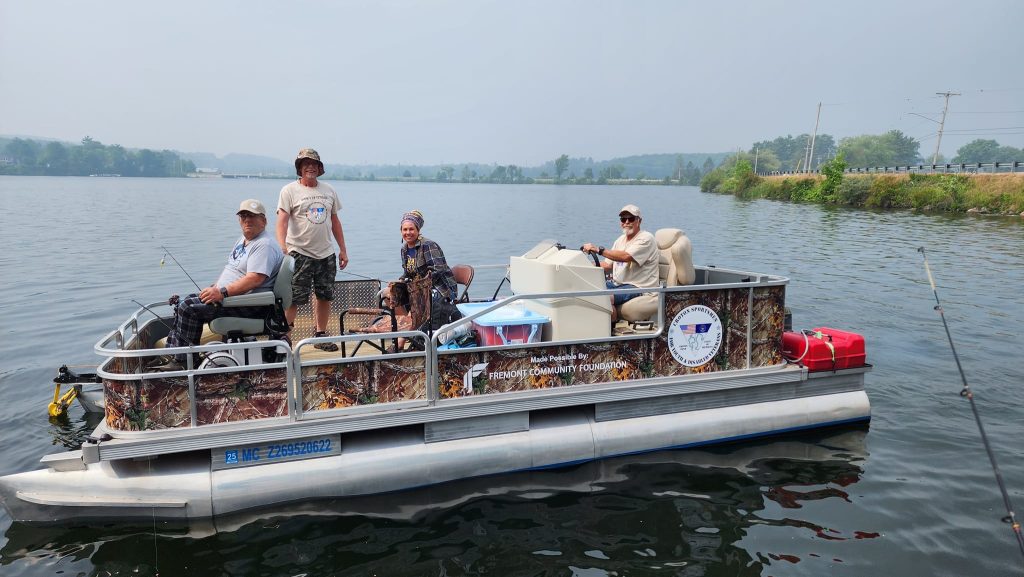 veterans out on the lake on a fishing trip