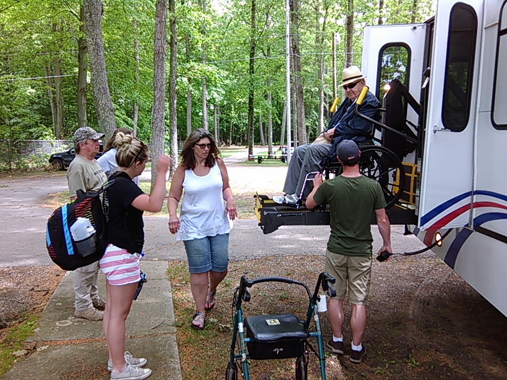 Veteran is lowered on bus wheelchair lift