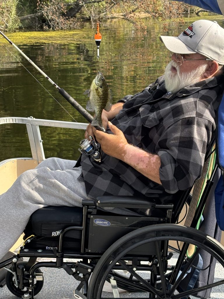 A veteran reels in his catch on the CSDVY boat