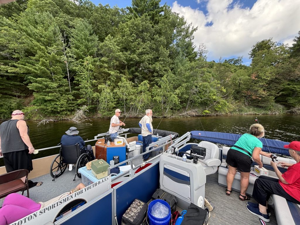 two pontoon boats are side by side during a CSDVY fishing trip